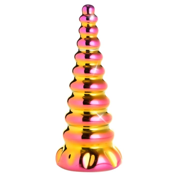 a pink and gold vase sitting on top of a table