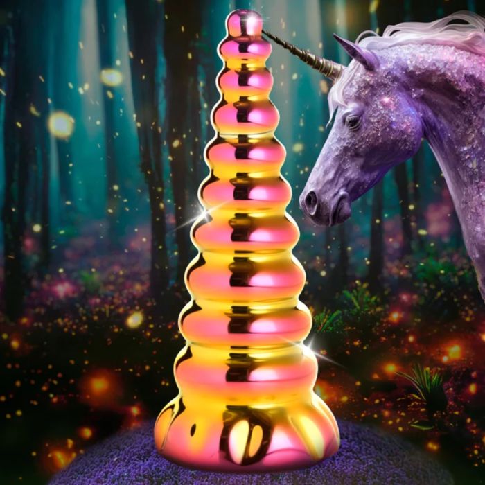 a purple unicorn standing next to a tall tower