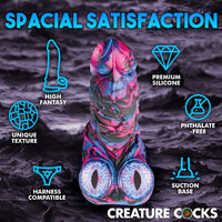 The Creature Cocks Alienoid Silicone Dildo displayed in a sophisticated setting, highlighting its cosmic colours and superior craftsmanship in body-safe silicone.