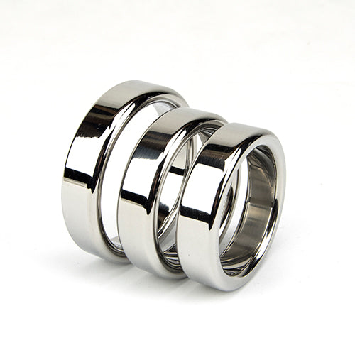 three silver cock rings sitting next to each other on a white abckground