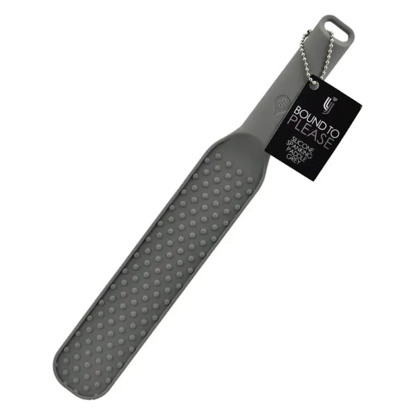 Bound to Please silicone spanking paddle with textured surface in grey, designed for impact play and sensory stimulation.