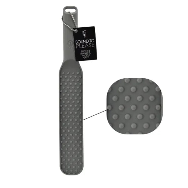 Grey silicone spanking paddle with textured surface from Bound to Please, designed for adult play and sensation.