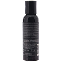 Black bottle with label on a white background