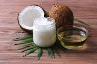 Thumbnail for a bottle of coconut oil next to a glass of coconut oil