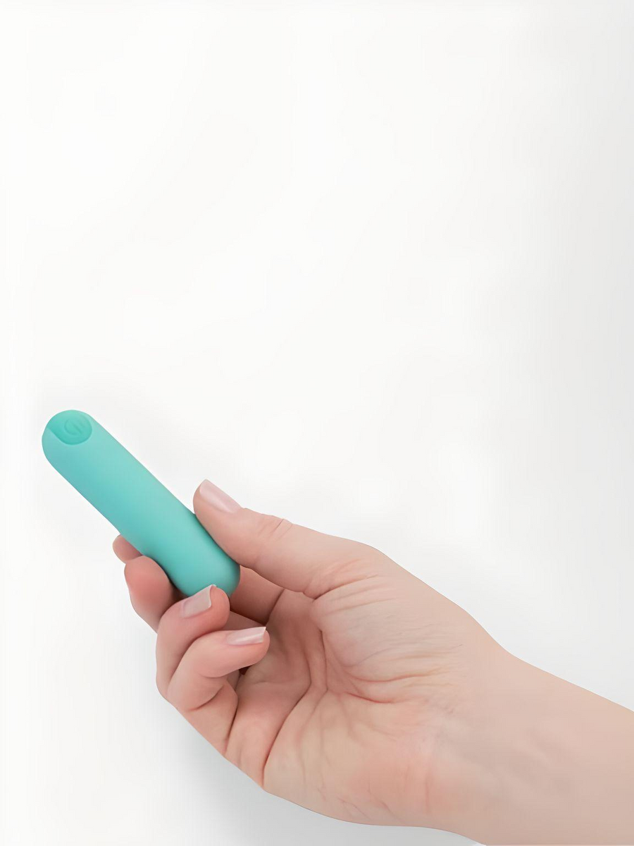 Power Bullet Essential 3.5" - Teal, elegantly held in hand, highlighting its compact design as a premium bullet vibrator.