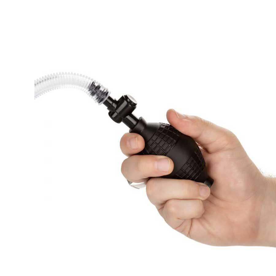a hand holding a black sprayer with a white background