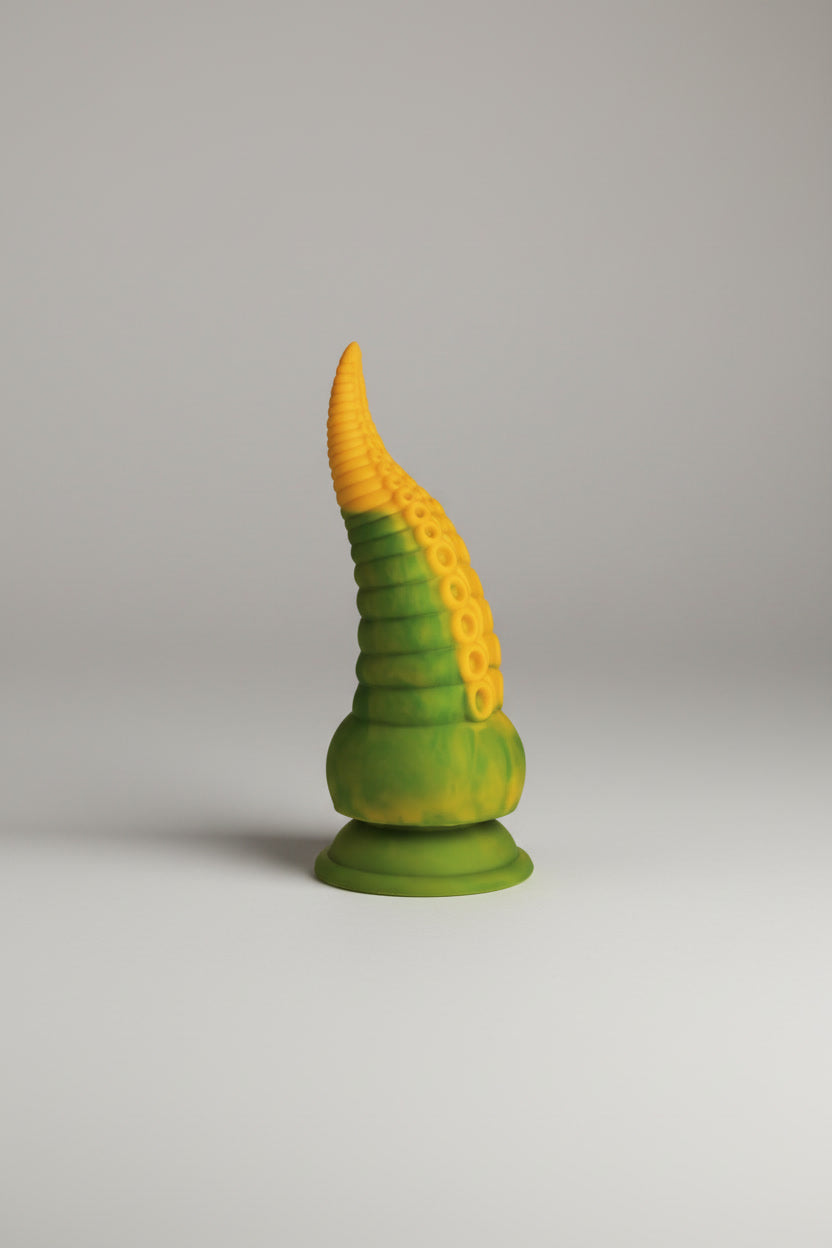 Creature Cocks Monstropus 2.0 vibrating tentacle silicone dildo on a light grey background, showcasing its detailed tentacle design.