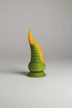 Creature Cocks Monstropus 2.0 vibrating tentacle silicone dildo on a light grey background, showcasing its detailed tentacle design.