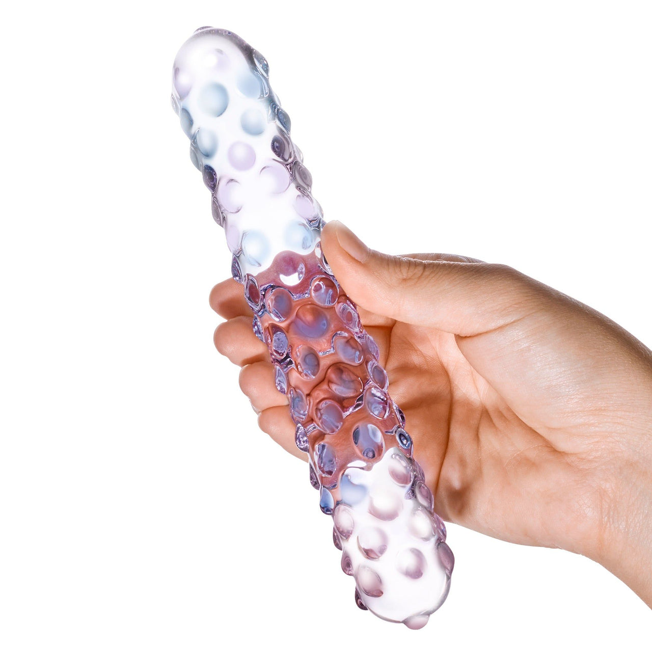 a hand holding a purple and white object