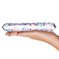 Thumbnail for a hand holding a glass tube with bubbles on it