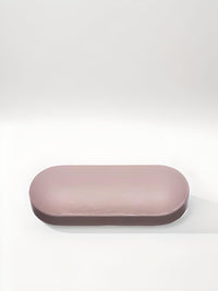 Thumbnail for a pink object sitting on top of a white surface