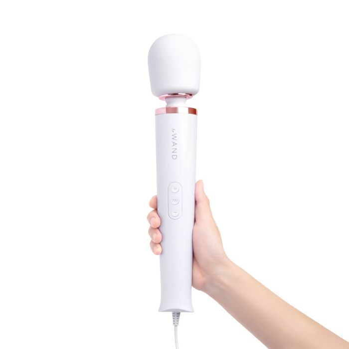 Le Wand Plug-In Vibrating Massager in white with adjustable attachments, designed for personal pleasure and relaxation.