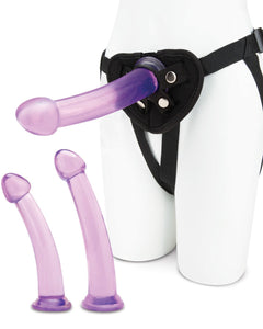 Lux Fetish 4-piece pegging training set with three dildos and adjustable harness for enhanced pleasure and comfortable wear.