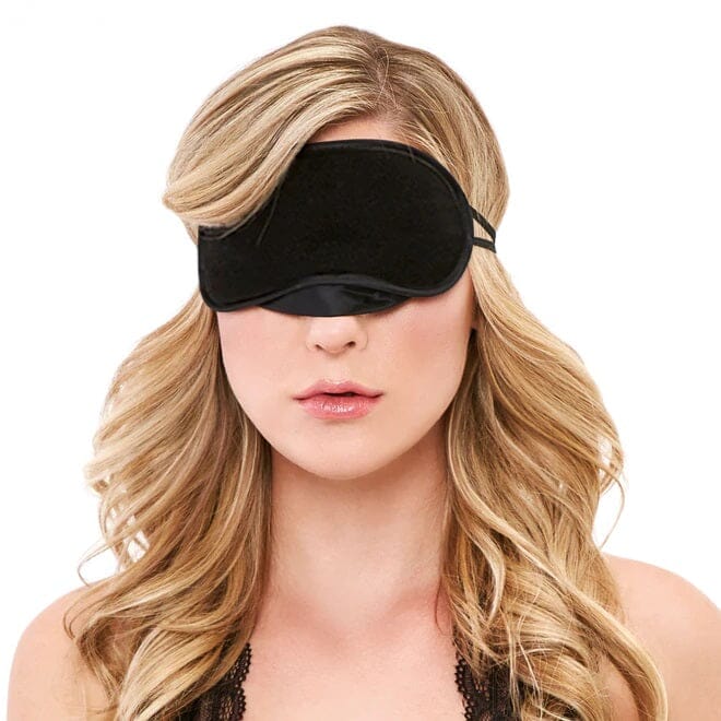 a woman wearing a black blinder over her eyes