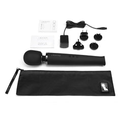 Black Le Wand rechargeable massager with sleek handle and attachment, designed for targeted relief and relaxation.