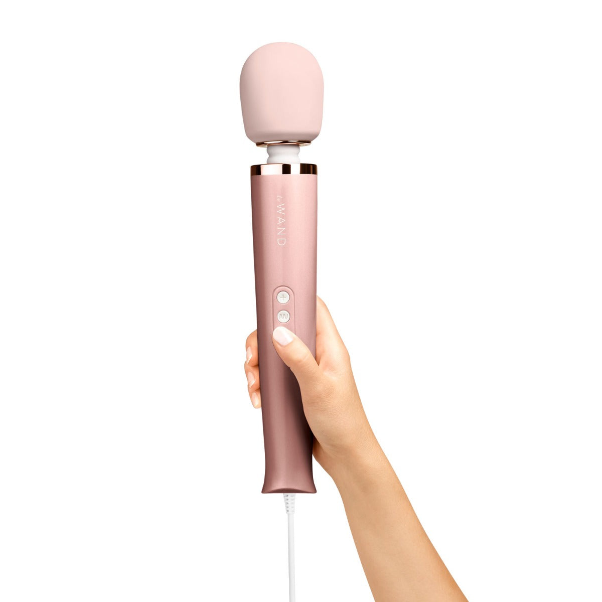 Le Wand plug-in vibrating massager with a hand holding the device, showcasing its sleek design and ergonomic shape.