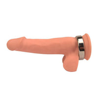 a dildo showing a metal cock ring around the balls and base