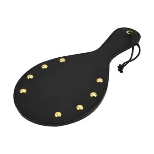 Bound Noir nubuck leather paddle with brass stud accents, designed for sensory play, featuring a sleek and sturdy handle.
