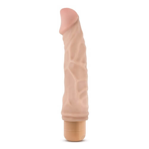 a fleshy dildo with a handle on a white background