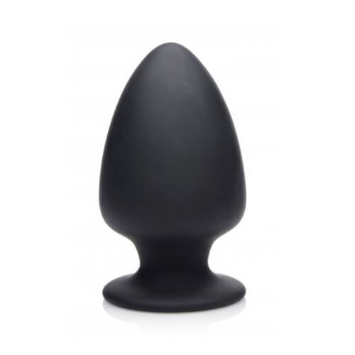 a black vase sitting on top of a white table