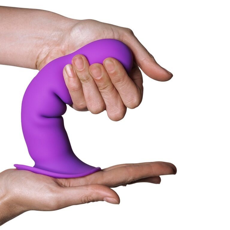 Hand demonstrating flexibility of a purple silicone dildo, showcasing its soft and pliable material for personalised pleasure.