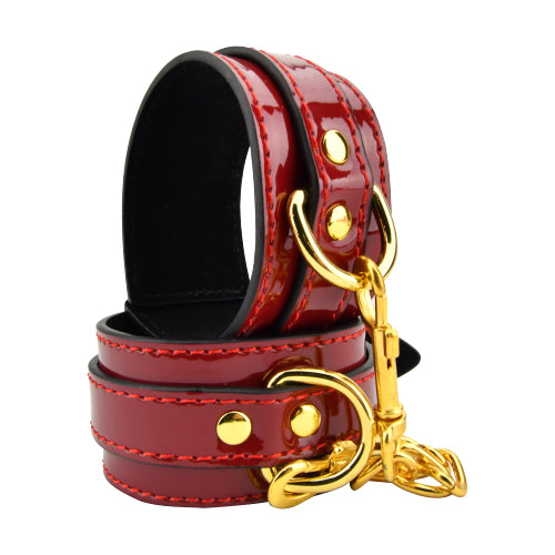 Bound to Please red wrist cuffs for beginners with glossy finish and soft faux-suede lining, designed for comfortable restraints.
