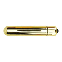 Lifestyle shot of the Loving Joy 10 Function Gold Bullet Vibrator in a sophisticated setting, highlighting its discreet and travel-friendly design.