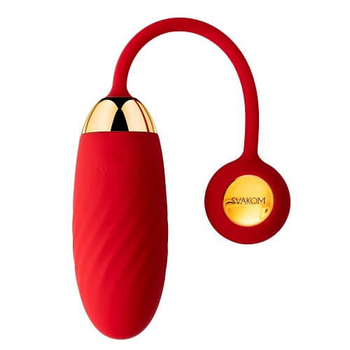 a red vibrating device with a gold top on a white background