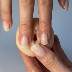 a woman's hand with a manicured nail polish caressing vagina masturbator