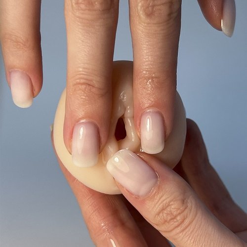 a woman's hand with a manicured nail polish caressing vagina masturbator