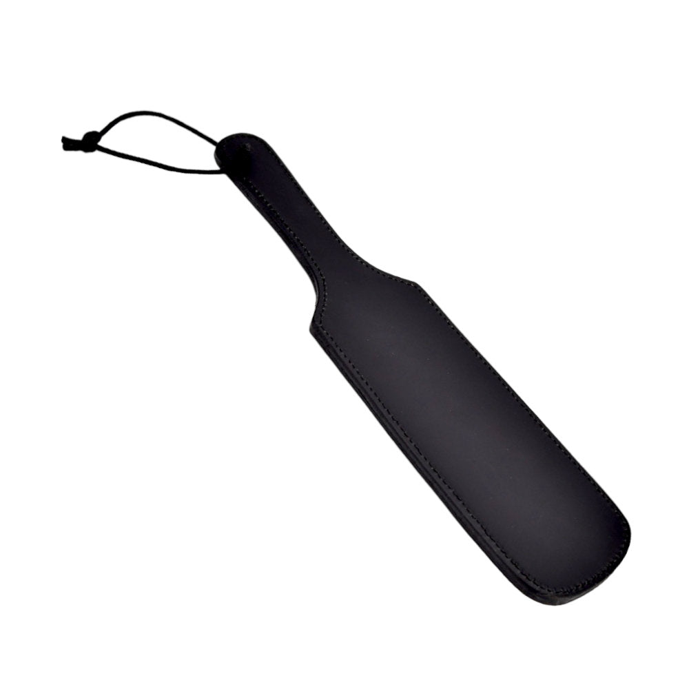 Bound leather paddle with secure wrist wrap for kinky play, featuring a sleek leather surface and sturdy handle.