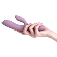 a person holding a purple object in their hand