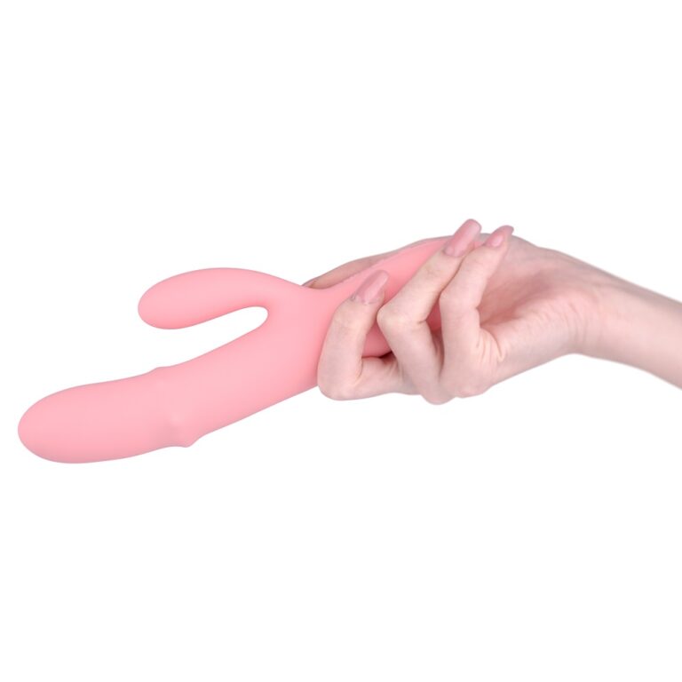 a person holding a pink object in their hand