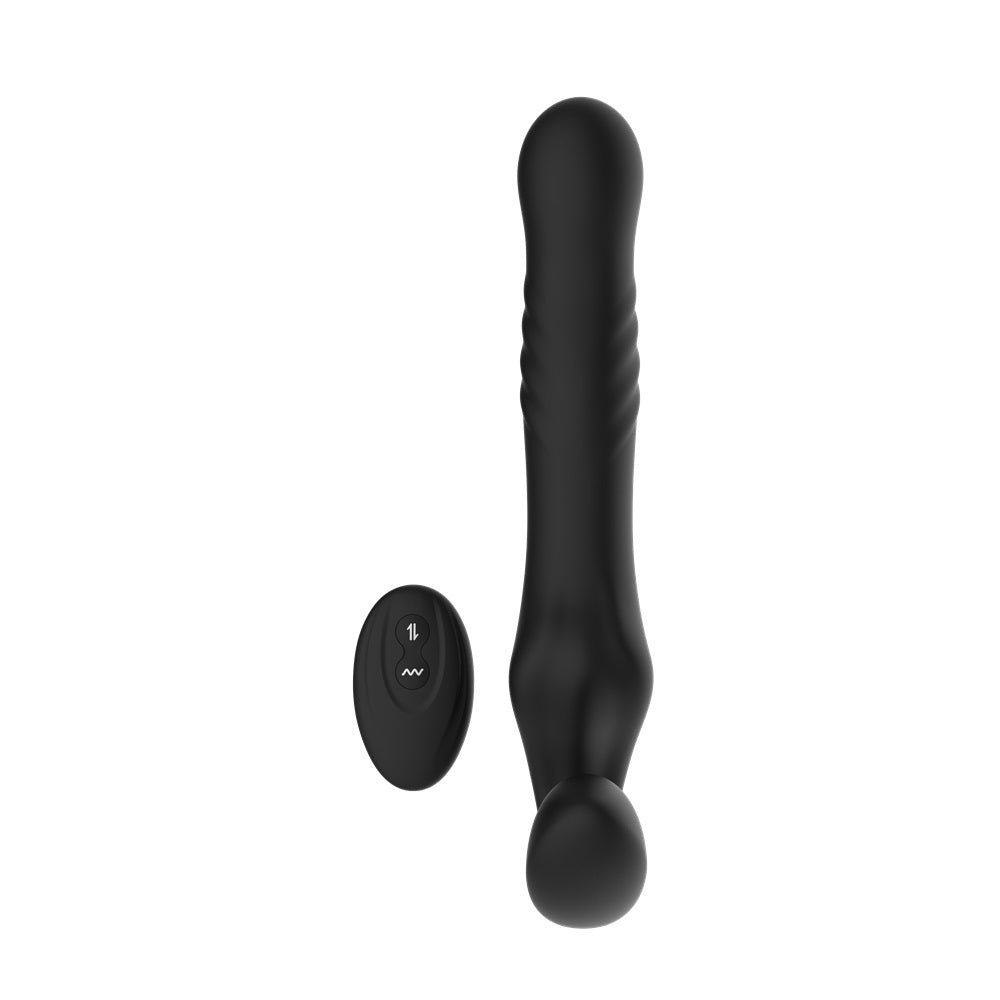 Close-up of the Mina Surge Remote Thrusting Vibrating Strapless Strap On highlighting its remote control feature and silicone texture.
