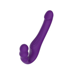 Elegant purple strapless strap-on showcasing a smooth and curvaceous design for exquisite pleasure.