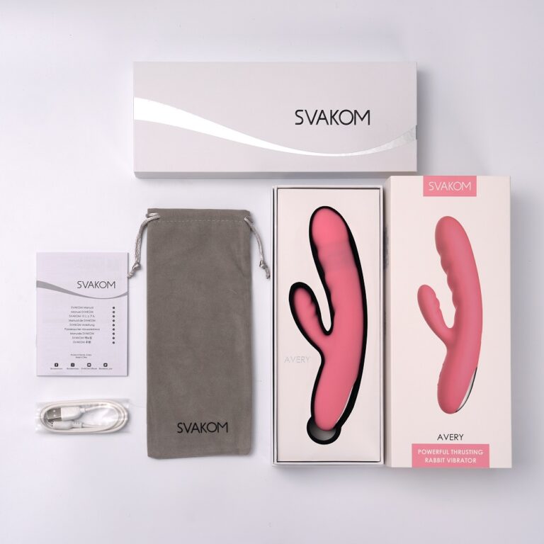 Pink Svakom Avery thrusting rabbit vibrator with clitoral stimulator, showcasing its sleek design and textured surface.