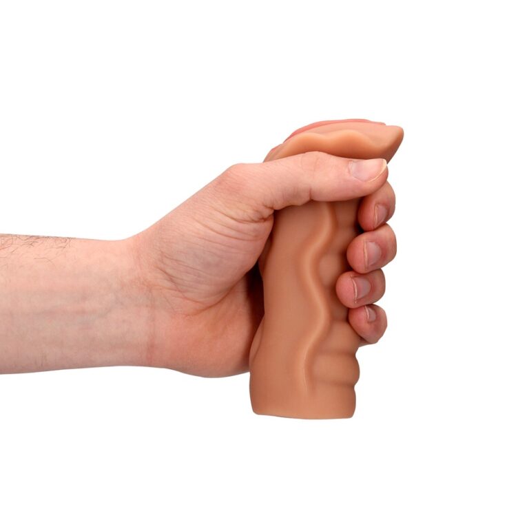 a hand holding a fake flesh like object