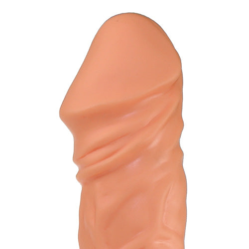 a close up of a pink plastic object on a white background