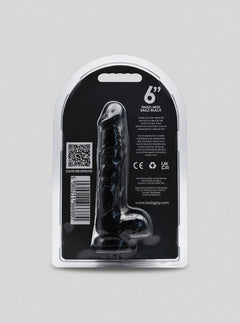 Loving Joy realistic black dildo with suction cup and testicles, made of body-safe material, designed for intimate pleasure.