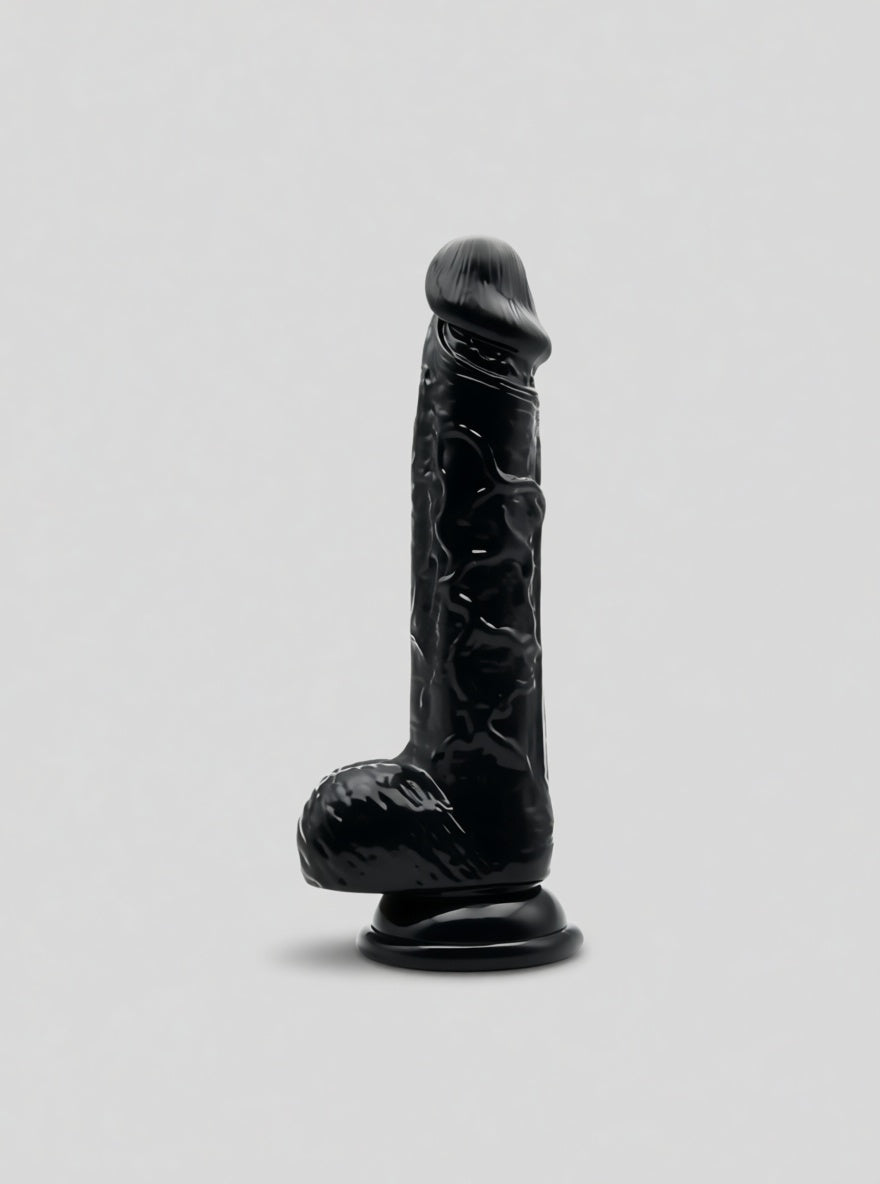 Realistic black dildo with suction cup and testicles from Loving Joy for adult pleasure and versatile use.
