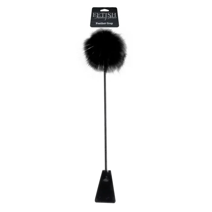 a black pole with a fur ball on top of it