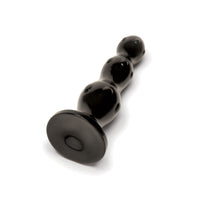 Close-up view of Prowler RED Triple Plug highlighting its beaded structure that promises deep sensation and pleasure.