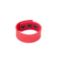 Thumbnail for a red bracelet with two black buttons on it