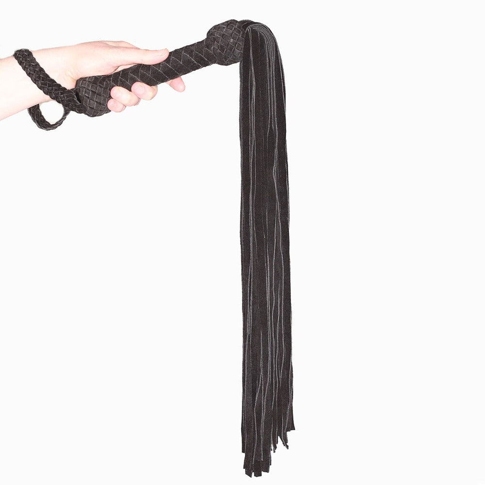 Black or red leather suede flogger by Prowler RED, featuring multiple tails and a sturdy handle for BDSM play.