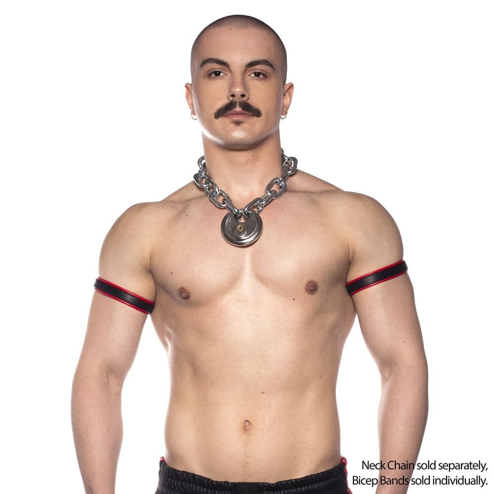Red men's fetishwear Prowler Bicep Band by Scandals, shown in image with snug fit and bold design on a model's arm.
