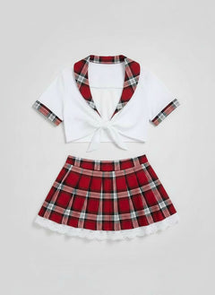 Model wearing the Sexy Tartan Schoolgirl Roleplay Outfit, highlighting the flirtatious crop top and pleated mini skirt, an ultimate sexy schoolgirl outfit for intimate evenings or themed parties.