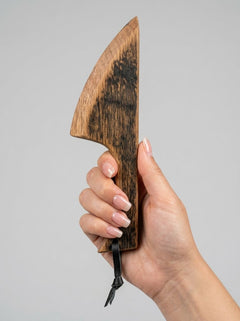 Handcrafted wooden BDSM wax play scraper made from whisky barrel oak, designed for kink and sensory stimulation by Barrel of Pain.