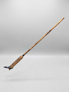 Hitty Stick from Barrel of Pain, a leather flogger with a wooden handle, designed for impact play and sensory stimulation.