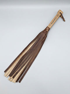 Handcrafted heavy-weight BDSM flogger with whisky barrel oak handle and repurposed leather tails from Barrel of Pain.