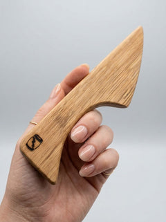 Handcrafted mini wooden BDSM wax play scraper made from whisky barrel oak, part of Barrel of Pain BDSM accessories collection.